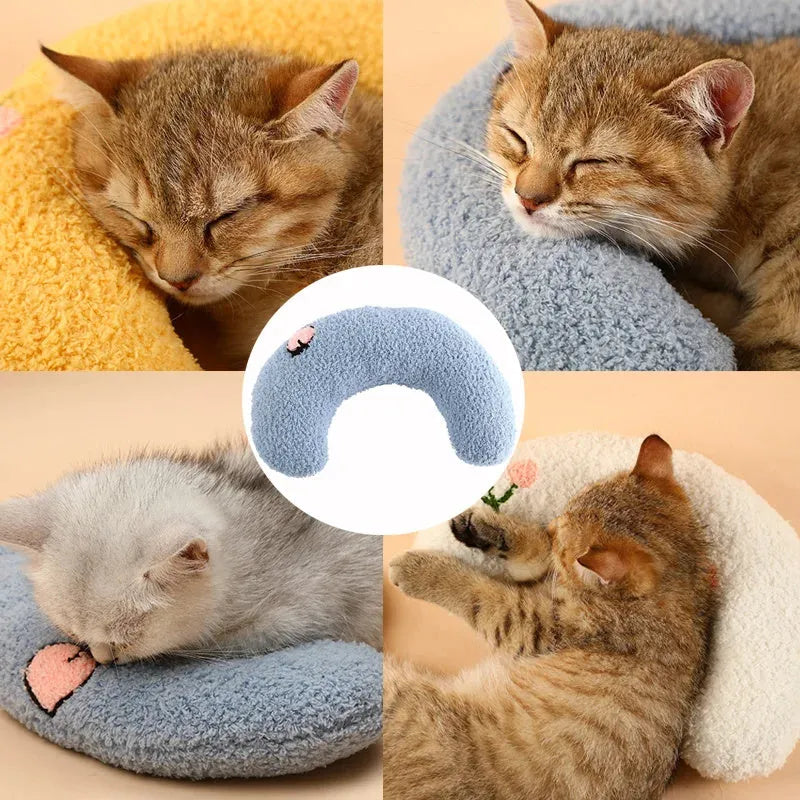 Soft quilted U-shaped cat pillow in blue, 26x18cm, on a clean white background