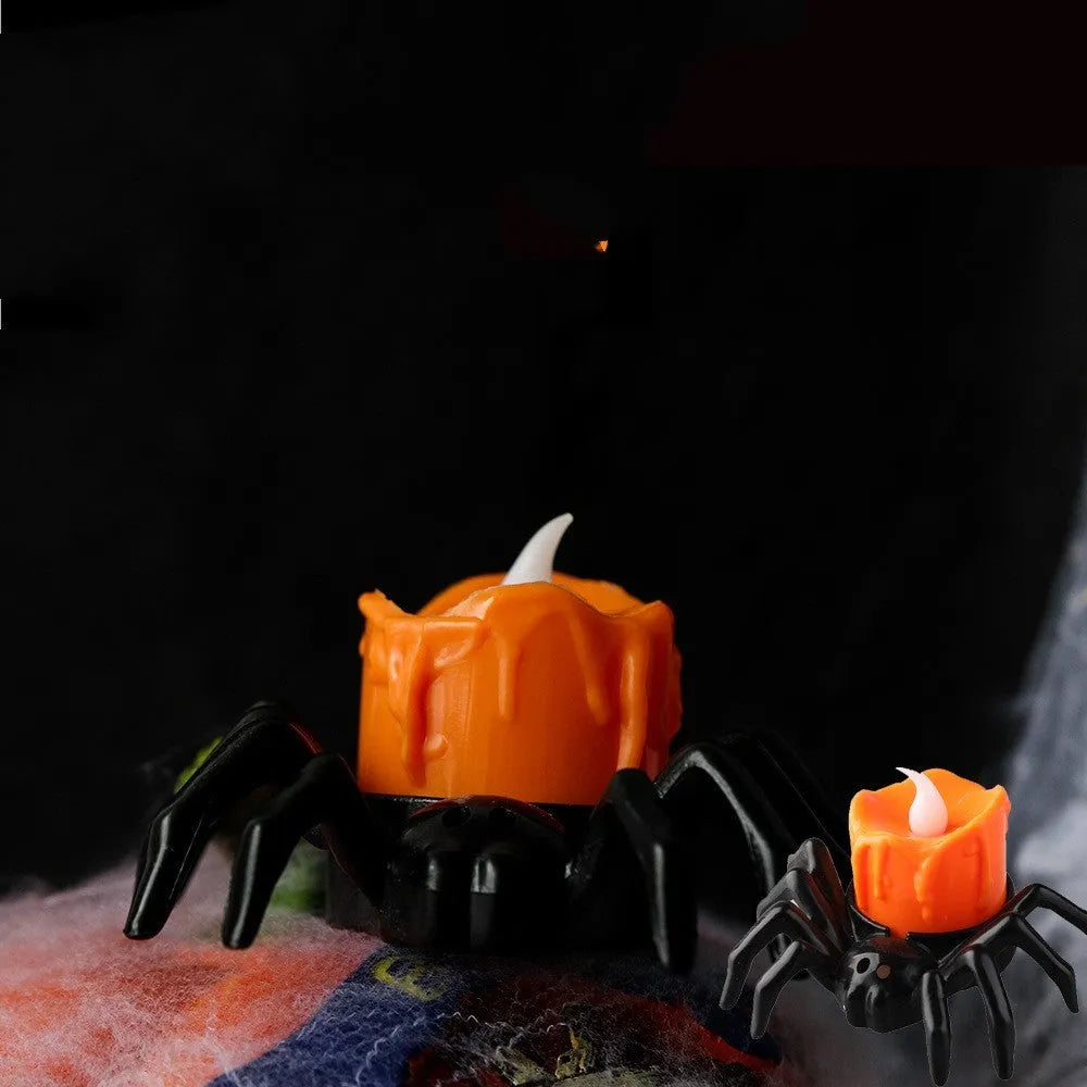 Plastic Halloween spider candlestick ornament with battery-operated candle light.