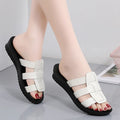 Beige women's flat bottom slippers with viscose upper and PU leather sole.