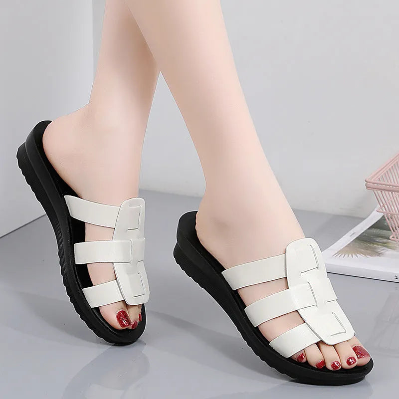 Beige women's flat bottom slippers with viscose upper and PU leather sole.