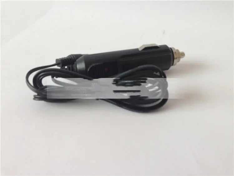 GKL112 compact white 220V car charger with UK plug on a car dashboard