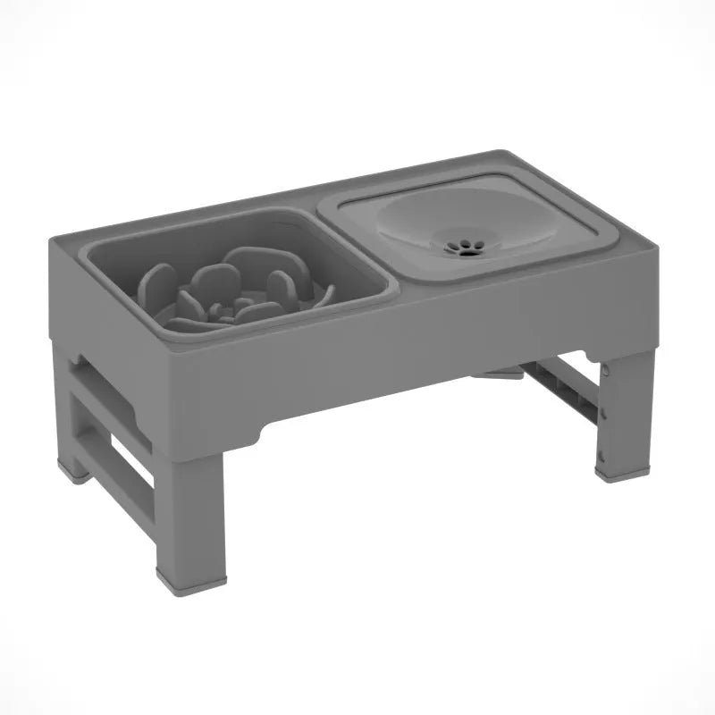 Black adjustable height dog feeding stand with two stainless steel bowls elevated on plastic stand