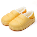 Green waterproof EVA cotton slipper with plush lining, flat sole, and hollow slip-on design.