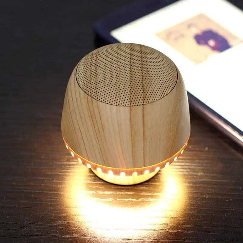 Portable mushroom-shaped Bluetooth speaker with LED night light, compact 55mm cube, in black colour