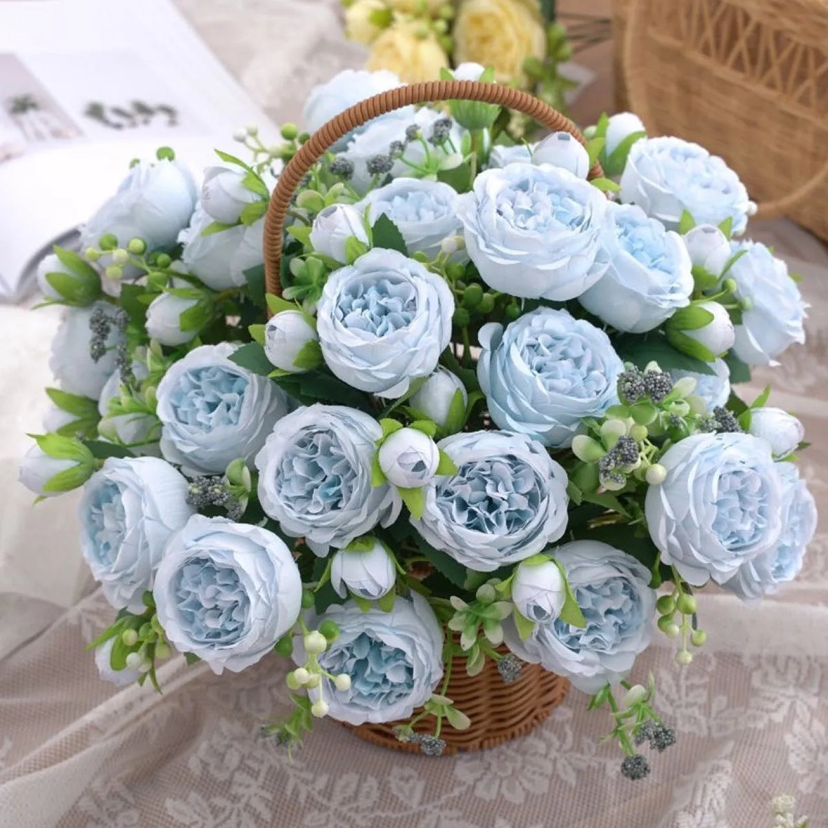 Artificial rose bouquet in pink beige champagne and light blue for wedding decoration, made from plastic and silk flower.