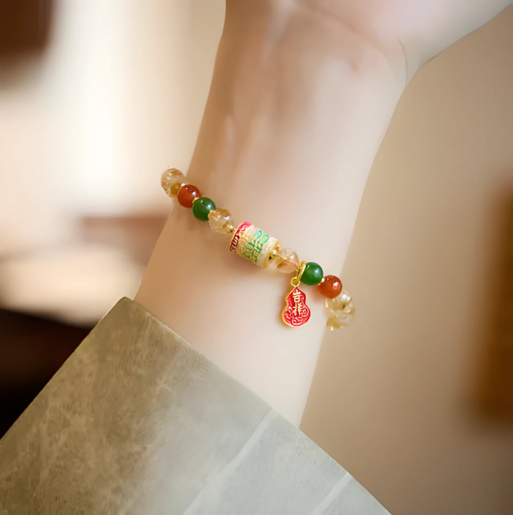 Hand-woven unisex bracelet with 6mm citrine beads in a five-sutra braid design.