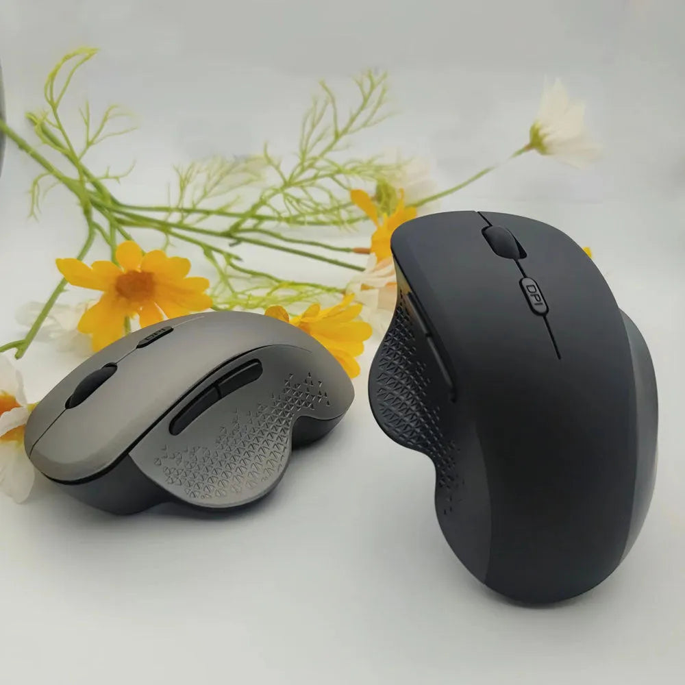 Black or grey self-charging wireless optical mouse for laptops with USB cable.
