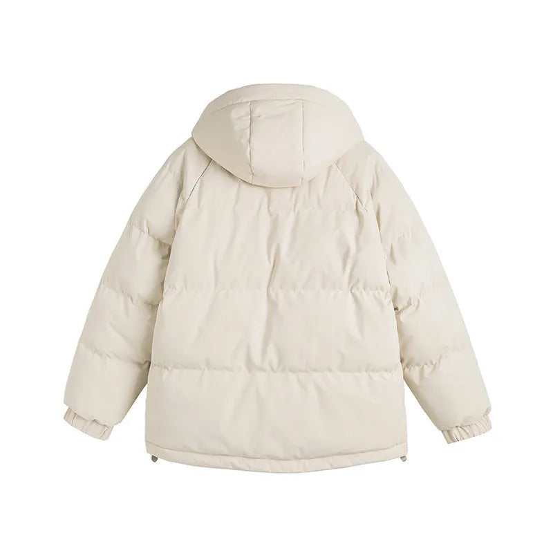 Loose thick polyester cotton-padded jacket in light blue on a hanger showing side seam pockets.