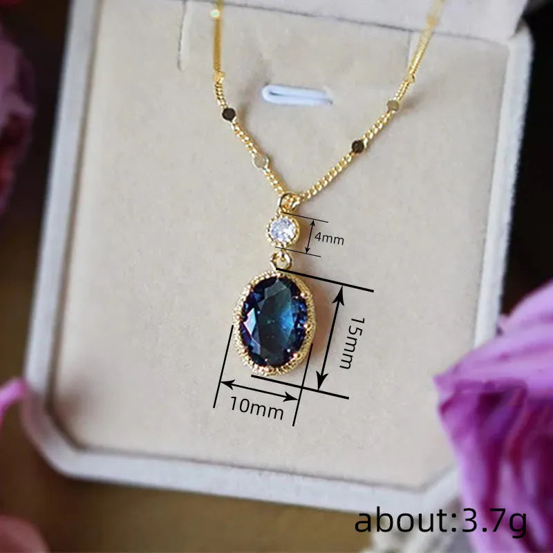 A gold-coloured geometric pendant on a copper chain necklace.