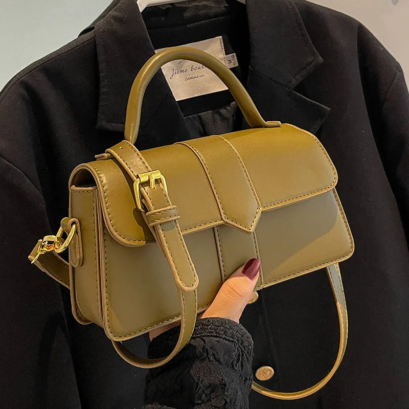 Women's beige messenger bag showing file compartment and sandwich pocket exterior