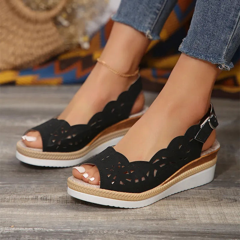 Women's fish-mouth wedge sandals in black with hollow buckle detail and thick PU sole