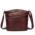 Large capacity PU bucket bag for women in black with multi-layer internal pockets and outer slit pocket