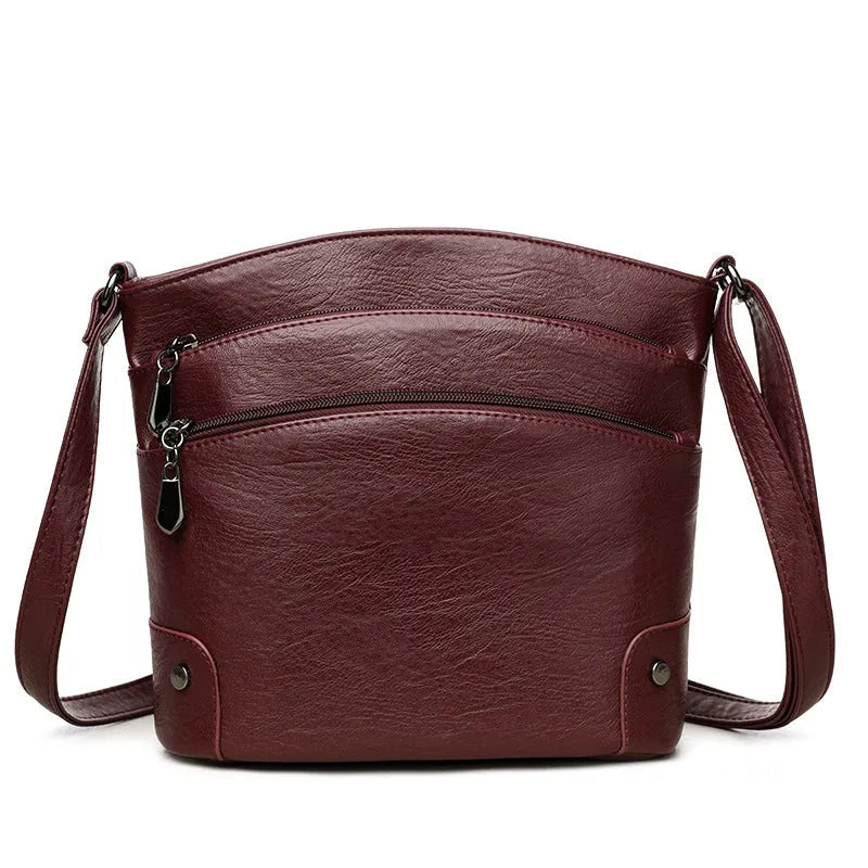 Large capacity PU bucket bag for women in black with multi-layer internal pockets and outer slit pocket