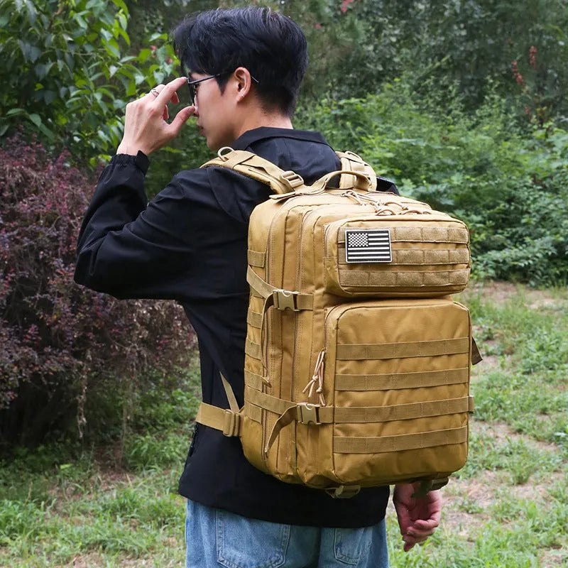 Large capacity waterproof travel backpack in camouflage oxford cloth, 56-75L, 48 x 31 x 31cm, army green and black options.