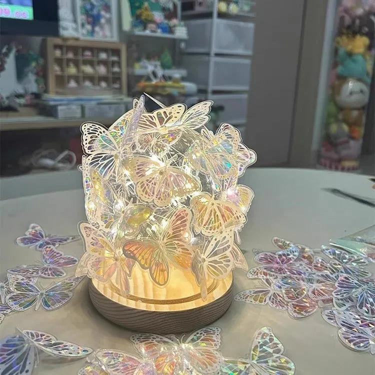 Butterfly night lamp DIY kit with glass lampshade and raw wood base, measuring 12cm by 15cm.