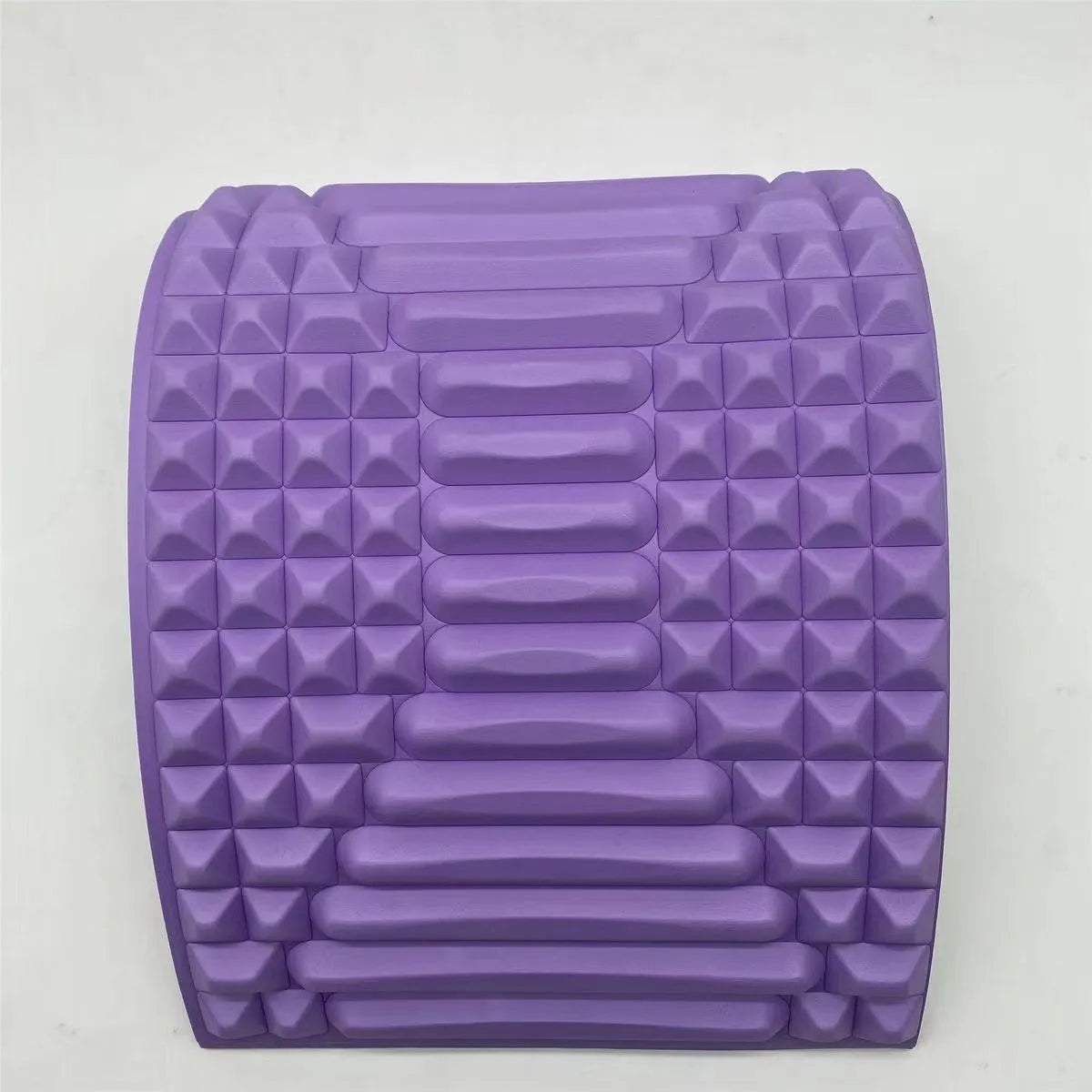 Blue back stretcher pillow for lumbar and neck support on a grey background.