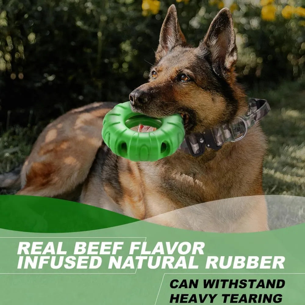 Blue, green, and red natural rubber tyre-shaped dog chew toy with oval openings for treat dispensing.