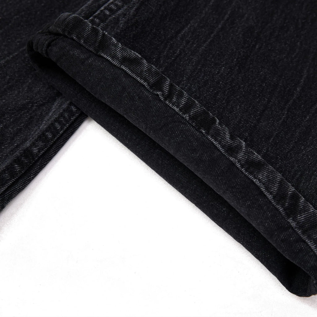 Men's black straight-leg jeans with lightning crack distressing on cotton denim