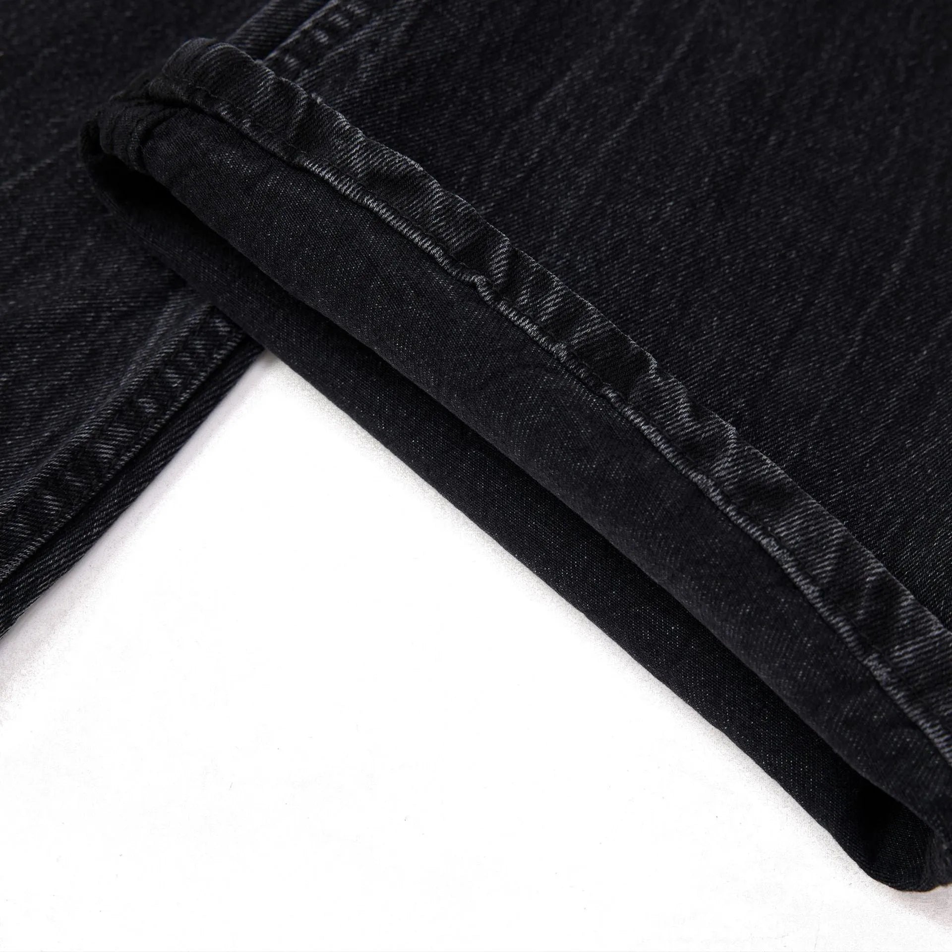 Men's black straight-leg jeans with lightning crack distressing on cotton denim