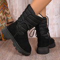 Women's black chunky heel snow boot with suede upper and lace-up design.