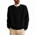 A grey men's textured knit half-zip pullover sweater on a hanger, showing the loose fit and long sleeves.