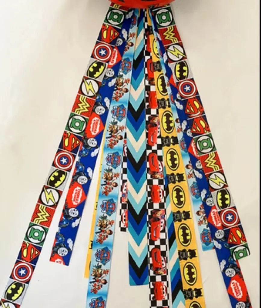 A decorative ribbon streamer for attaching to a child's roller skate or ski helmet, shown in a selection of colours.
