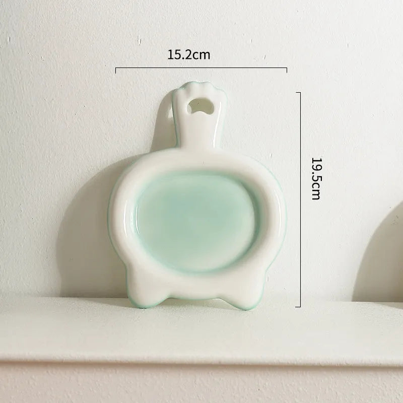 Blue ceramic cat bowl with shallow design for pet food and water
