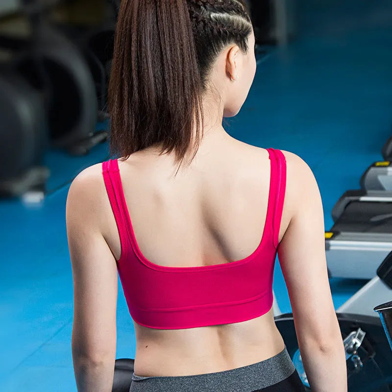 Women's reinforced shockproof sports bra in pink with thin mould cup and fixed double shoulder straps.