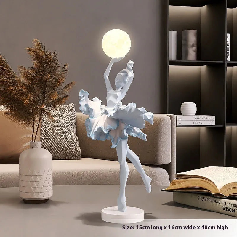 Modern art girl style resin night light with USB charging cable in black gold colour.