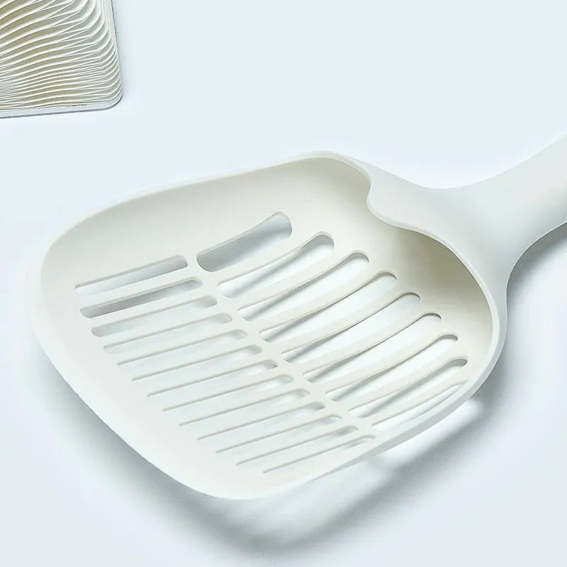 White plastic cat litter scoop with storage base for pet hygiene