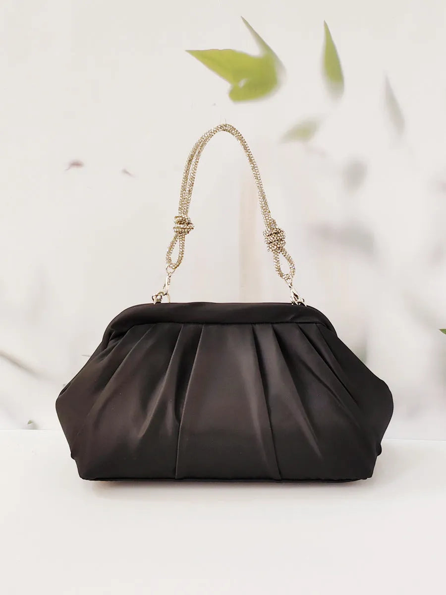 Women's soft polyester messenger bag in lavender purple with a chain strap and shell shape.