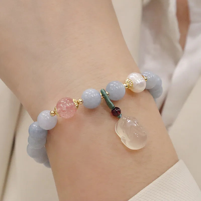 Women's gold-plated bracelet with artificial crystal and chalcedony pendant in climbing cat design