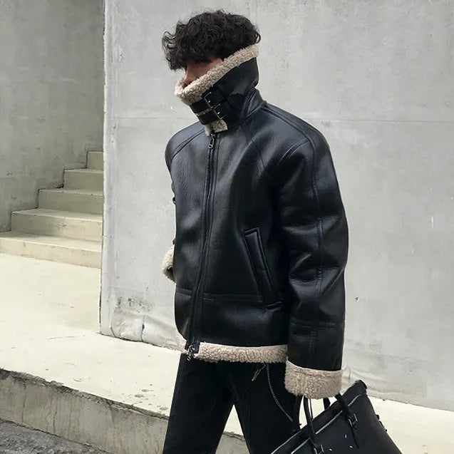 Men's black PU leather jacket with padded collar, front zip, and long sleeves on a model