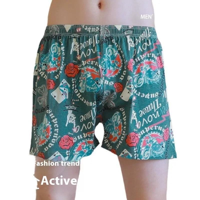 Men's grey printed cotton boxer shorts with a loose, casual fit and mid-waist design.