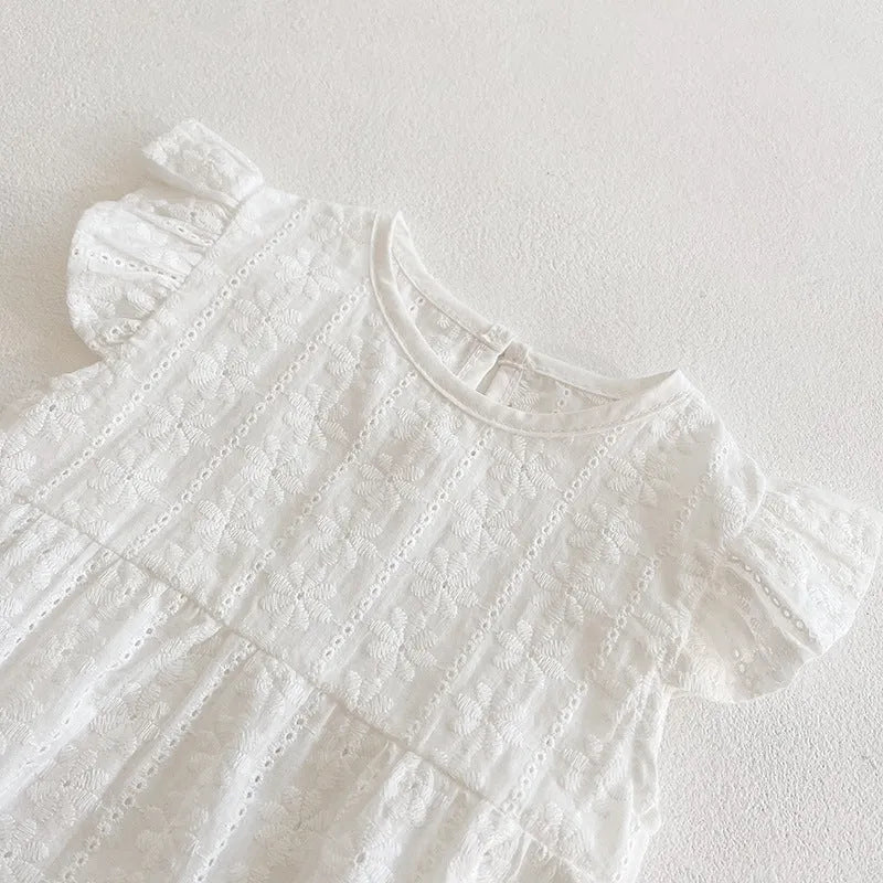 Creamy white cotton lace triangle jumpsuit for baby girl with short sleeves and button closure