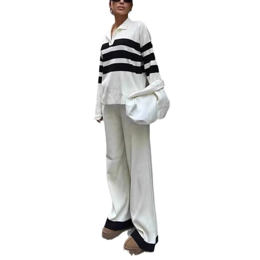 Women's black and white striped polo collar knitted top with matching trousers, a casual two-piece set.