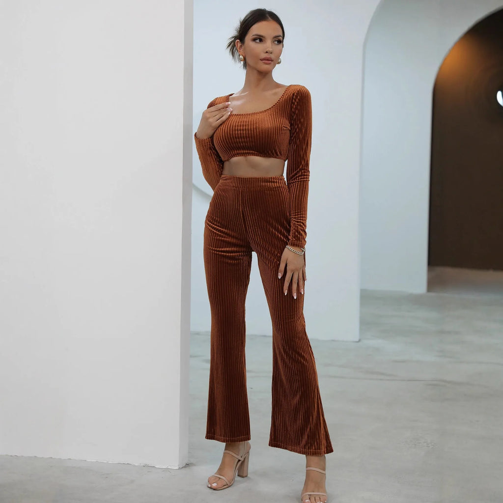 Caramel coloured long sleeve sweater and trouser set laid flat, showing casual two-piece design.
