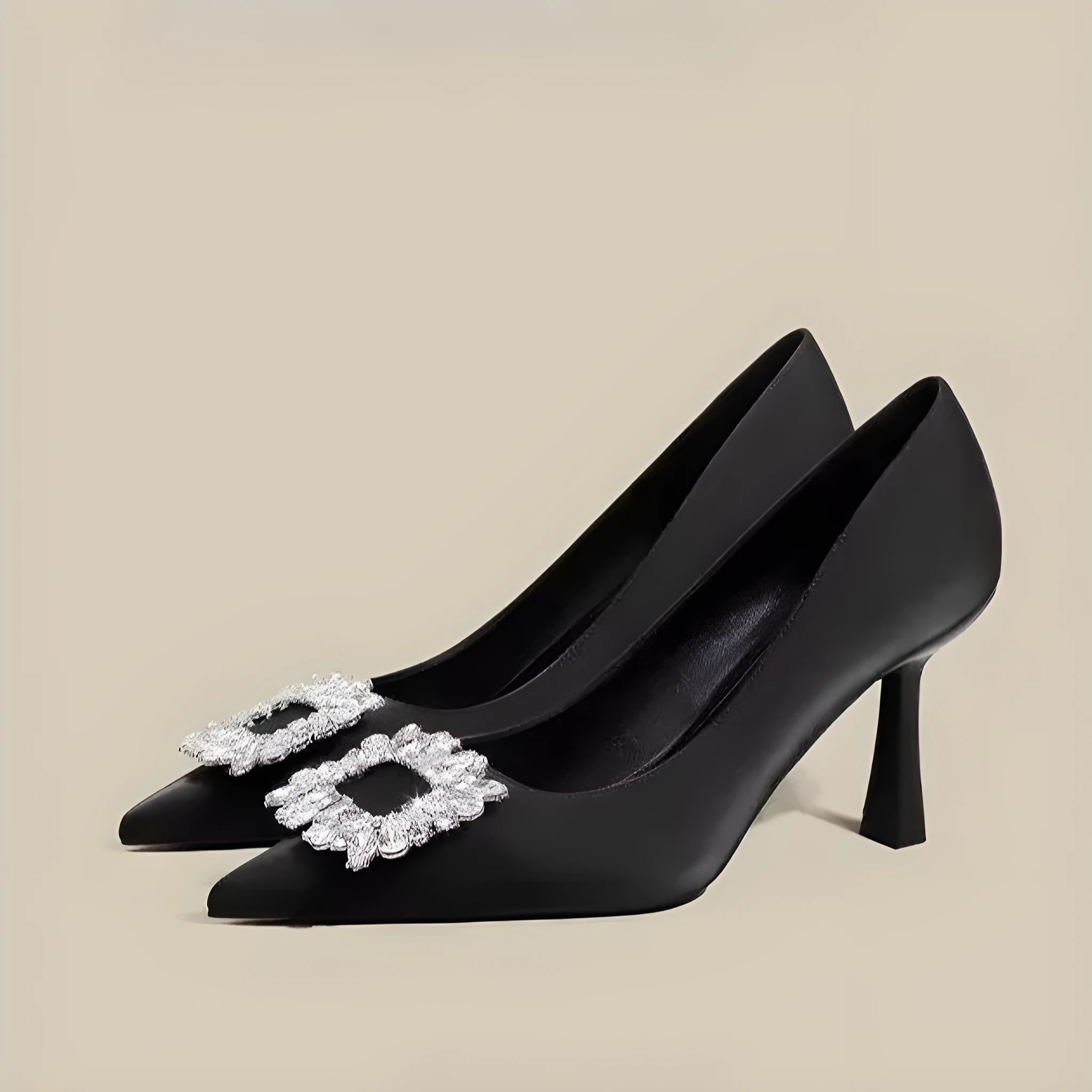Women's creamy-white pointed-toe stiletto high heels on a plain background.