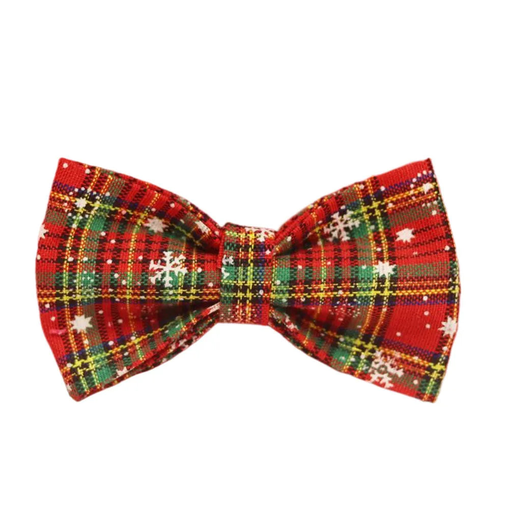 Four-piece Christmas pet accessory set with red snowflake collar, plaid leash, festive vest, and bow tie