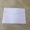 Pack of 10 mini coloured non-printed envelopes in various colours, shown next to a business card for scale.