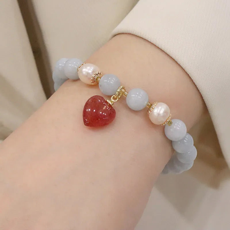 Women's gold-plated bracelet with artificial crystal and chalcedony pendant in climbing cat design