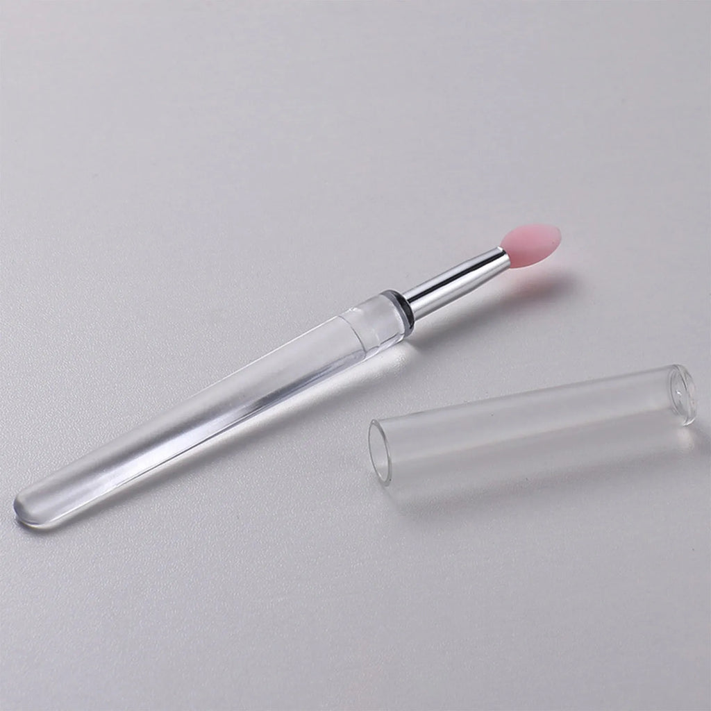 Set of four reusable silicone lip brushes with silicone caps in assorted colours