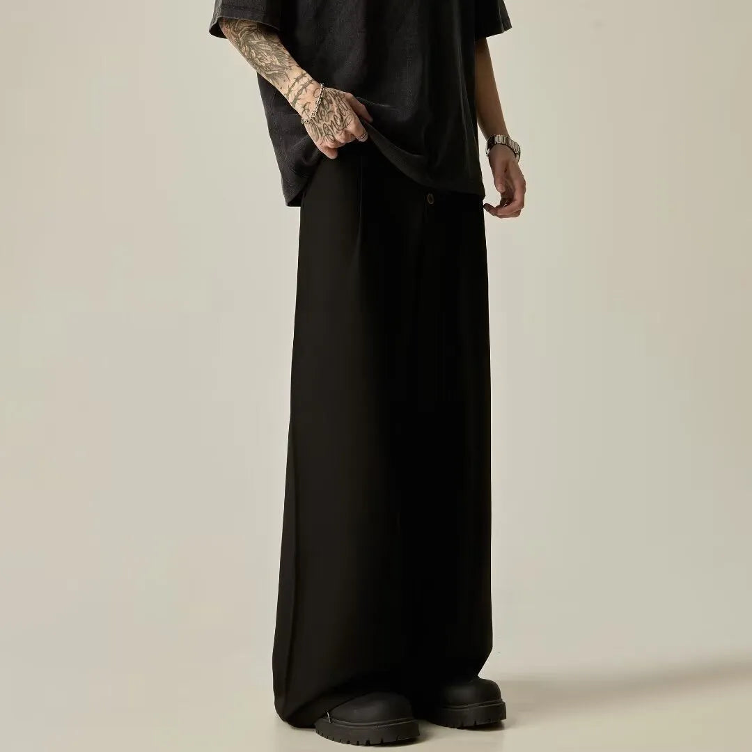 Men's black wide-leg straight-leg casual trousers made from a cotton-polyester blend fabric.