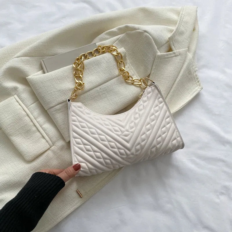 Brown vertical PU leather shoulder bag with a silver pleated chain strap and a soft handle.