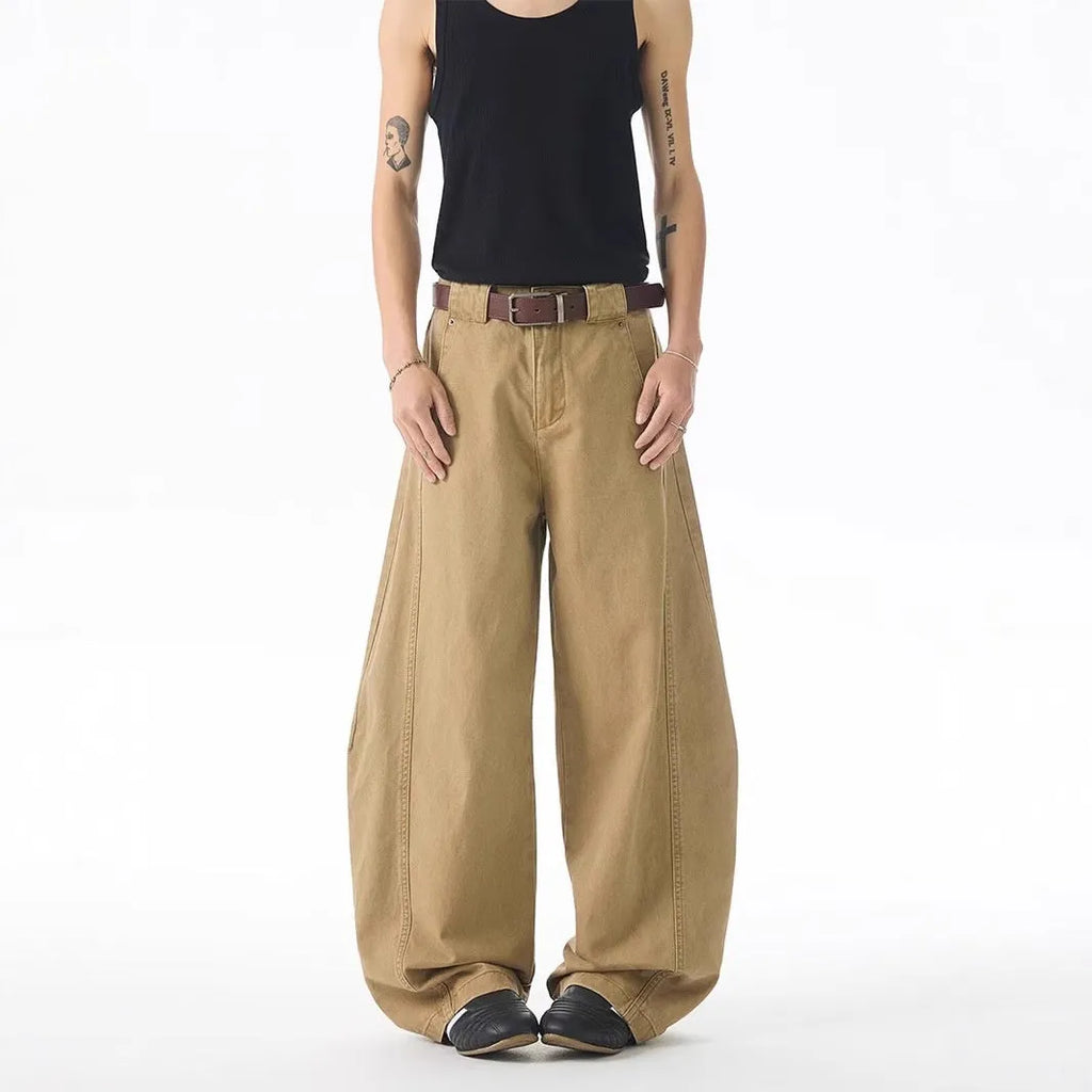Men's brown loose-fit straight-leg casual jeans with a button fly on a mid waist.