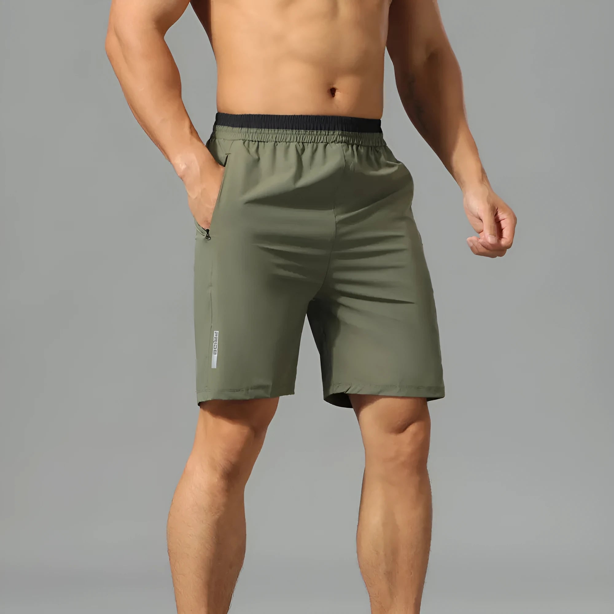 Men's grey loose fit cropped running pants made from quick-dry Ice Silk fabric for workouts.