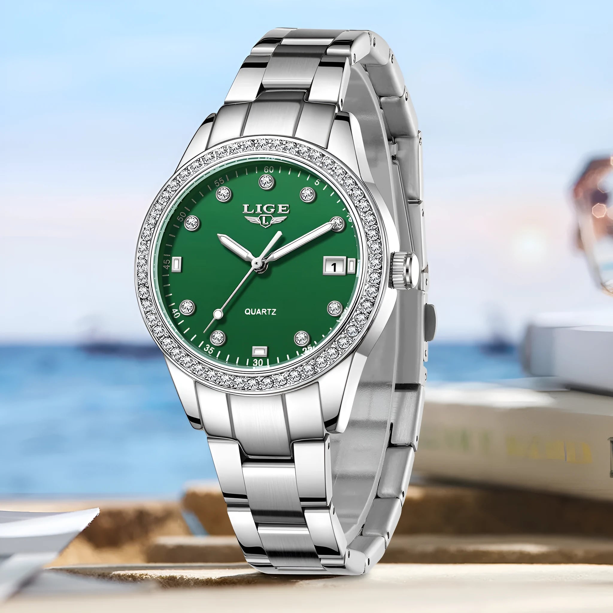 Silver fashion quartz watch with diamond bezel, round white dial, and luminous hands on a stainless steel strap.