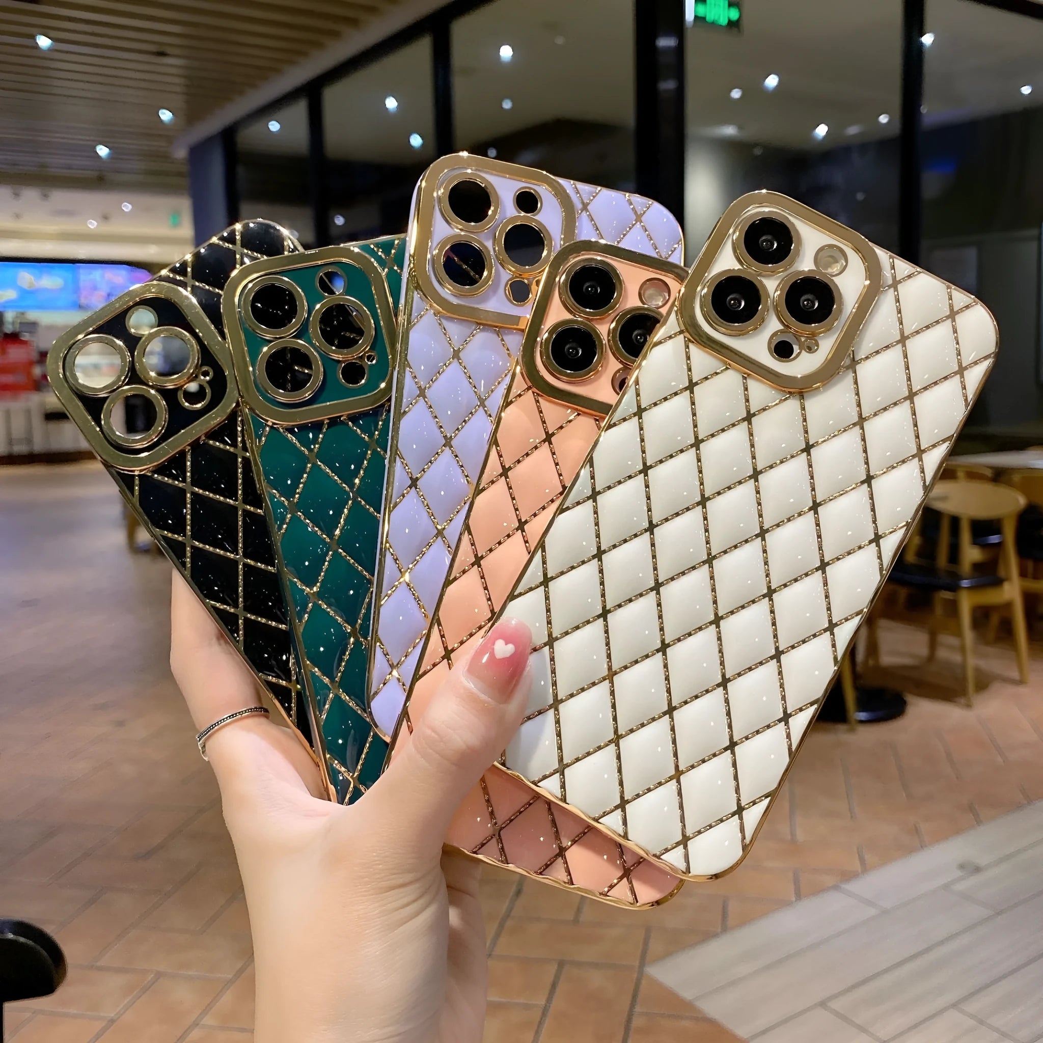 Electroplated 6D diamond TPU iPhone back cover in black, angled view with reflective pattern