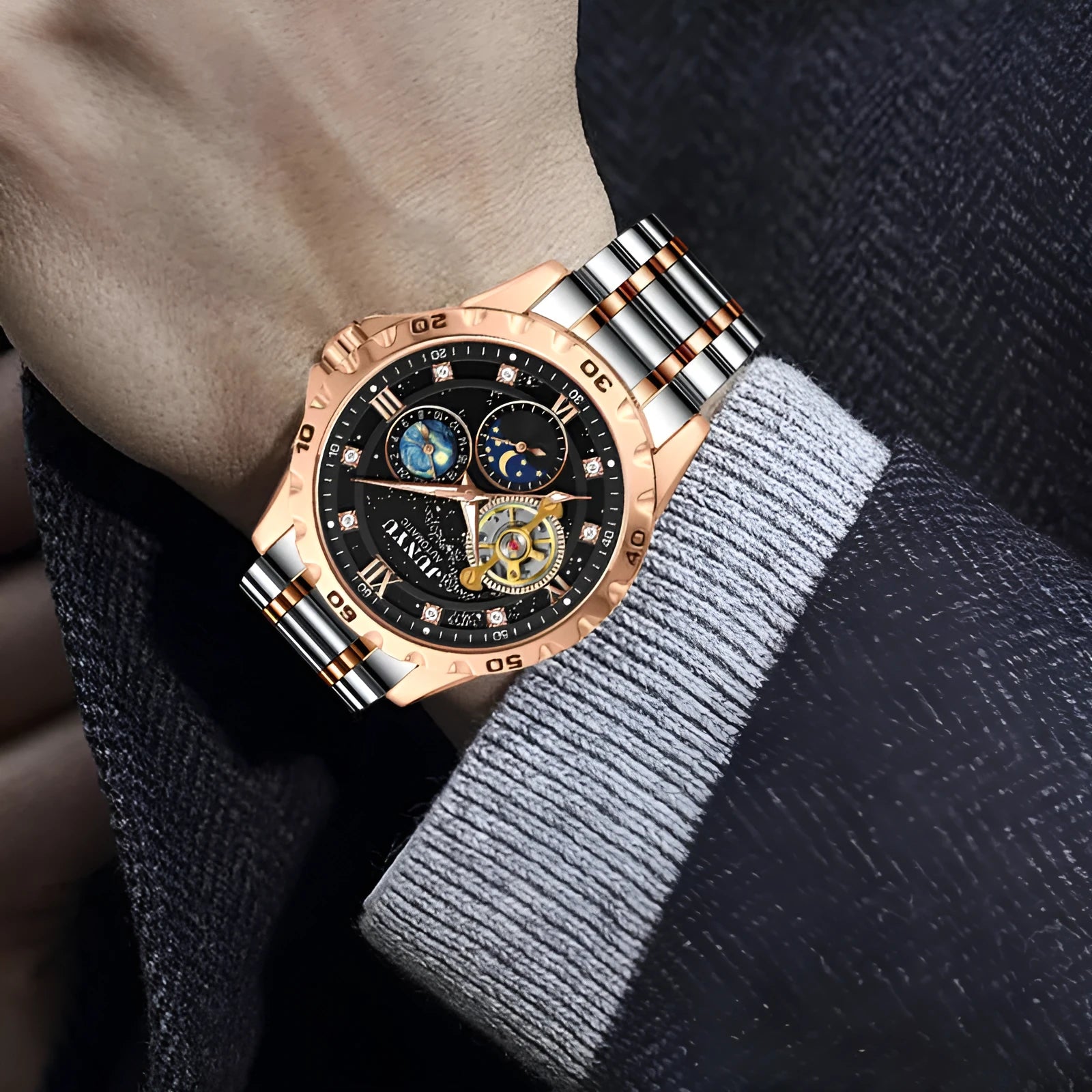 Men's automatic mechanical watch with luminous hands on a wrist, shown in rose gold with a black starry sky dial.