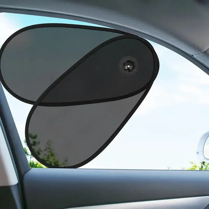 Black breathable mesh car window shade stretched over a car side window, showing suction cup attachment.